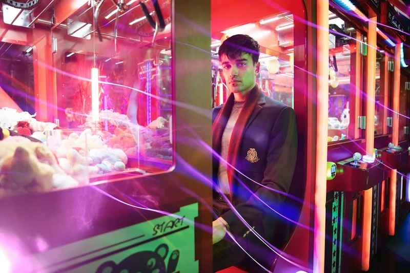 A man standing in front of a vending machine